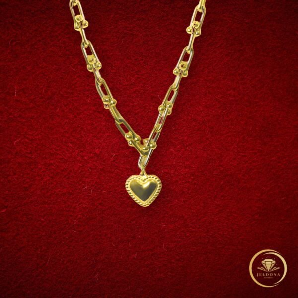 Golden Embrace Heart Necklace in red cloth